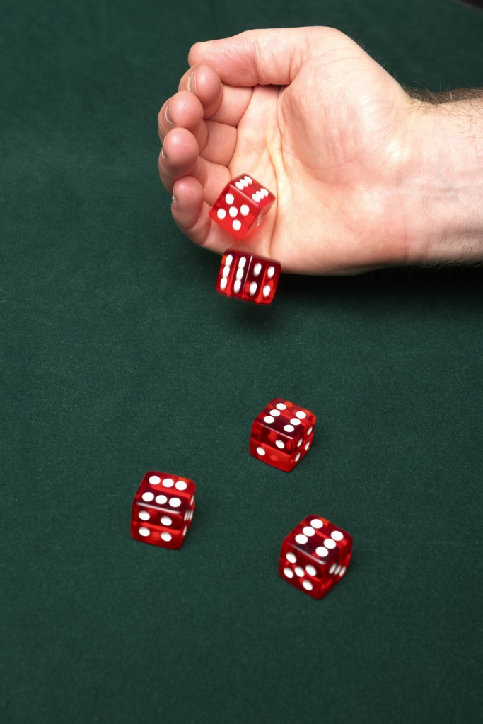 Man Rolling 5 Red Dice - Exkalibur.com